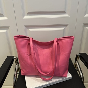 Pink faux leather tote bag with crocodile pattern finish and long shoulder straps
