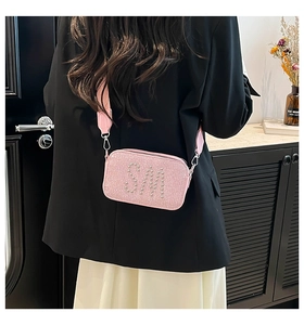 Pink glitter camera bag with silver stud SM logo and stylish wide shoulder strap