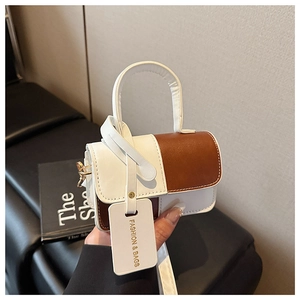 Detail of contrast stitch mini bag with dual straps and Fashion & Bags decorative tag