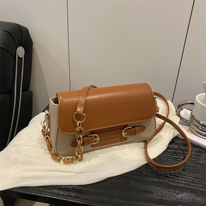 Contrast color crossbody bag in dark brown and beige faux leather with gold chain details