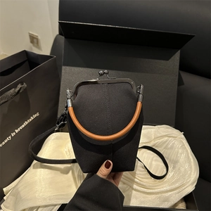 Retro black canvas doctor bag with silver frame closure and brown leather handle