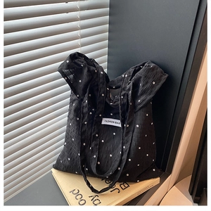 Black floral tote bag with wrinkled texture and fashion tag for women summer 2025