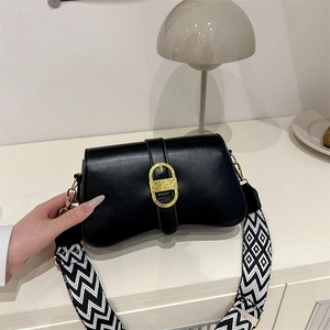 Black vintage chic crossbody bag with golden buckle and geometric wide strap for women