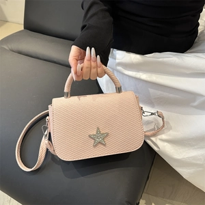 Pink quilted chain handbag with crystal star buckle and elegant woven top handle
