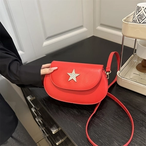 Minimalist red semi-circular crossbody bag with sparkling rhinestone star decoration