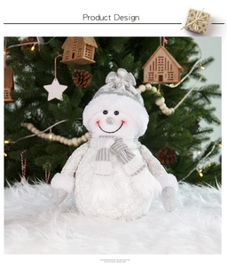 Detailed view of plush Christmas snowman with grey knit hat on white faux fur rug