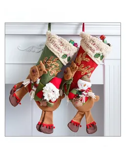 Detail of plush Christmas stockings featuring 3D Santa and snowman with embroidery