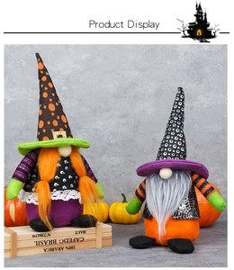 Close-up of two Halloween witch gnomes with pointed hats and plush textures decorations