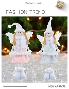 Detailed view of pink and grey Christmas angel dolls with snowflake patterns and wings