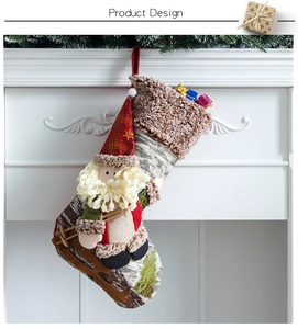 Detail of Christmas stocking featuring 3D Santa on sled over white fireplace background