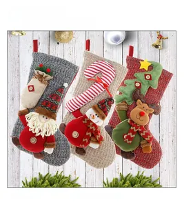 Detail of 3D Santa, Snowman, and Reindeer on knitted Christmas stockings for gifts