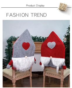 Detail view of red and grey gnome chair covers with white beards in a Christmas setting