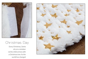 Detail of white plush Christmas tree skirt featuring gold foil stars and Velcro fastener