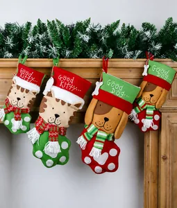 Detail of plush Christmas pet stockings with Good Kitty and Good Dog embroidery