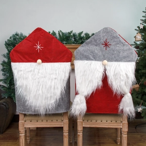 Christmas gnome chair covers in red and grey felt with plush beards for dining room decor