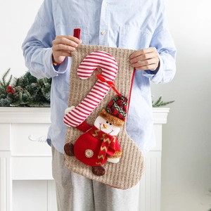 Large knitted Christmas stocking with 3D snowman and candy cane, festive holiday gift bag