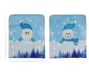 Dettaglio coprisedie natalizi a LED con Babbo Natale e pupazzo di neve, dimensioni 52x43cm