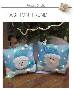 Detail of LED glowing Christmas pillowcases featuring Santa and Snowman embroidery