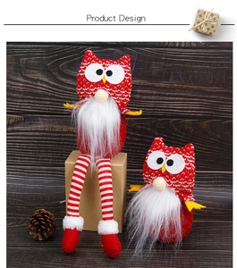 Detail of Christmas owl gnomes featuring knit hats and white faux fur beards on wood