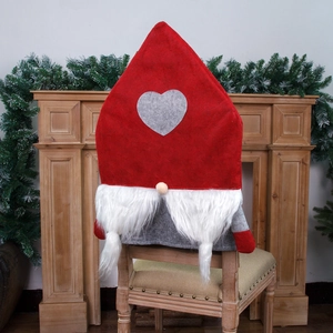 Nordic Christmas gnome chair cover with heart pattern and long beard for holiday dining decor