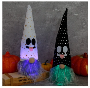 Macro-opname van lichtgevende Halloween-kabouters met zwart-wit gestippelde puntmutsen
