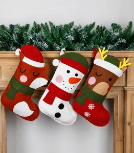 Detailed close-up of felt Christmas stockings featuring fox, snowman, and reindeer characters