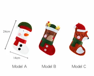 Detail view of felt Christmas stockings with snowman elk and fox embroidery designs