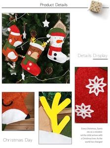 Detail of felt Christmas stockings featuring fox, reindeer, and snowman embroidery