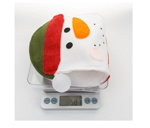 Weight measurement display of a felt Christmas snowman stocking gift bag at 58.7g
