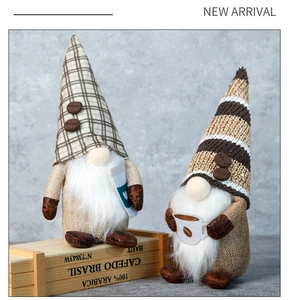 Detail of coffee gnomes with plaid hats and mini coffee cups on wooden rustic boxes