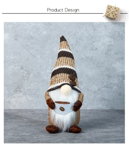 Close-up of coffee gnome doll featuring a striped knit hat with coffee bean details