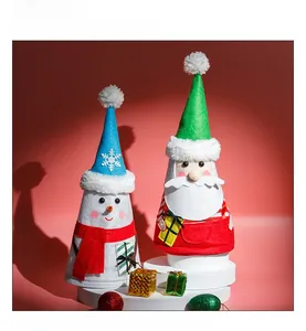 Detailed view of handmade Santa and Snowman felt dolls on red festive display stands
