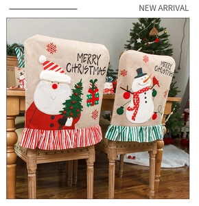 Detail of Santa and Snowman linen chair covers with Merry Christmas embroidery and 3D applique