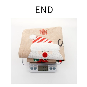 Detailed view showing an 89.7g Christmas burlap chair cover weight on a digital scale
