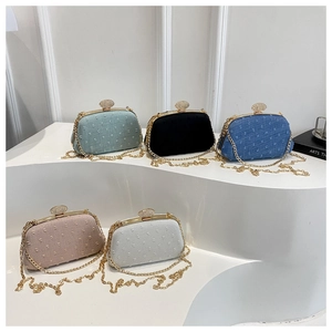 Collection of textured evening clutch bags in five colors with rhinestone clasps