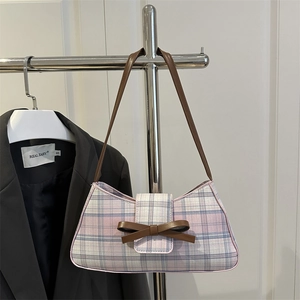 Vintage plaid underarm bag with a brown leather bow and a long shoulder strap