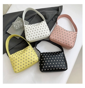 Detailed collection of four studded leather handbags in cream, pink, yellow, and black colors