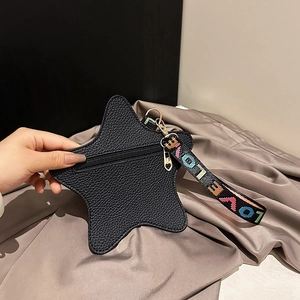 Star-shaped black leather coin purse with LOVE ribbon handle and heart zipper puller