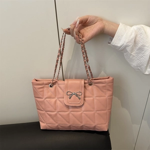 Pink quilted shoulder bag with chain strap and silver bow detail for elegant commuting