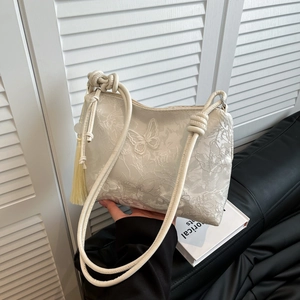 White lace tote bag with 3D butterfly embroidery and elegant silk tassel detail