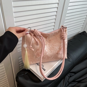 Pink embroidery shoulder bag with butterfly floral patterns and long yellow tassels