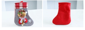 Detailed view showing the front reindeer design and red felt back of the linen Christmas sock