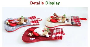 Detail view of linen Christmas stockings with bells, Santa, snowman and elk appliques