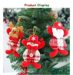 Detail of red Christmas tree ornaments with reindeer, snowman and Santa Claus figures