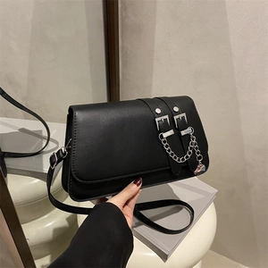 Chic black baguette shoulder bag with silver chain and double buckle strap detail