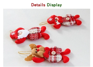 Detailed close-up of Santa, snowman and reindeer plush pendants with red plaid fabric
