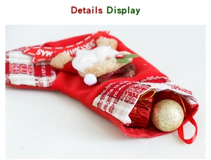 Detail view of red Christmas stocking with 3D Santa Claus and Merry Christmas banner