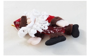 Close-up of Santa plush ornament with curly beard, embroidery eyes and golden hanging rope