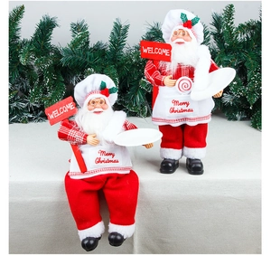 Standing and sitting chef Santa Claus dolls with Merry Christmas apron and welcome sign