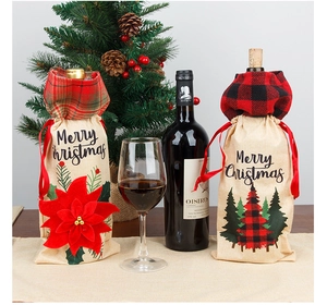 Detail of burlap Christmas wine bottle covers with red poinsettia and plaid accents